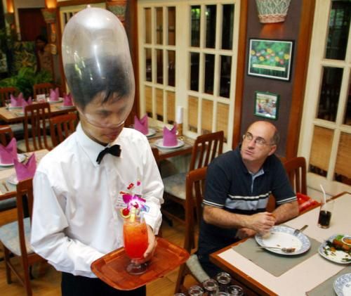 Cabbages and Condoms in Thailand - Waiter at Cabbages and Condoms