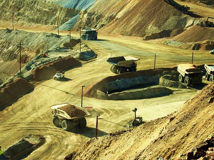 The Bingham Canyon Mine - Mine haul trucks moving ore in Bingham Canyon copper mine