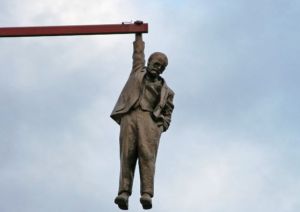 The Statue of a Man hanging by one hand